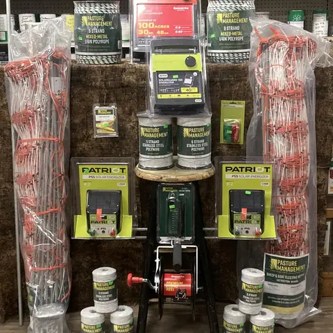 Display of electric fence chargers, tape and insulators