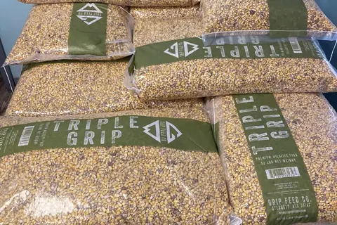 Stacked bags of Triple Grip feed