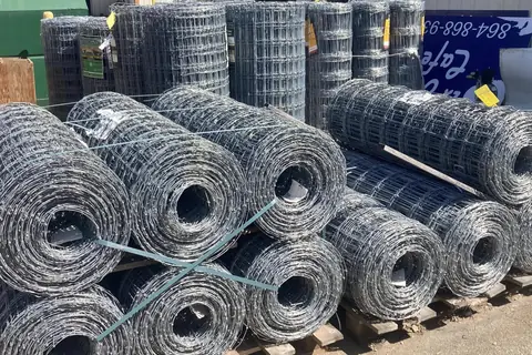 Rolls of woven wire fencing
